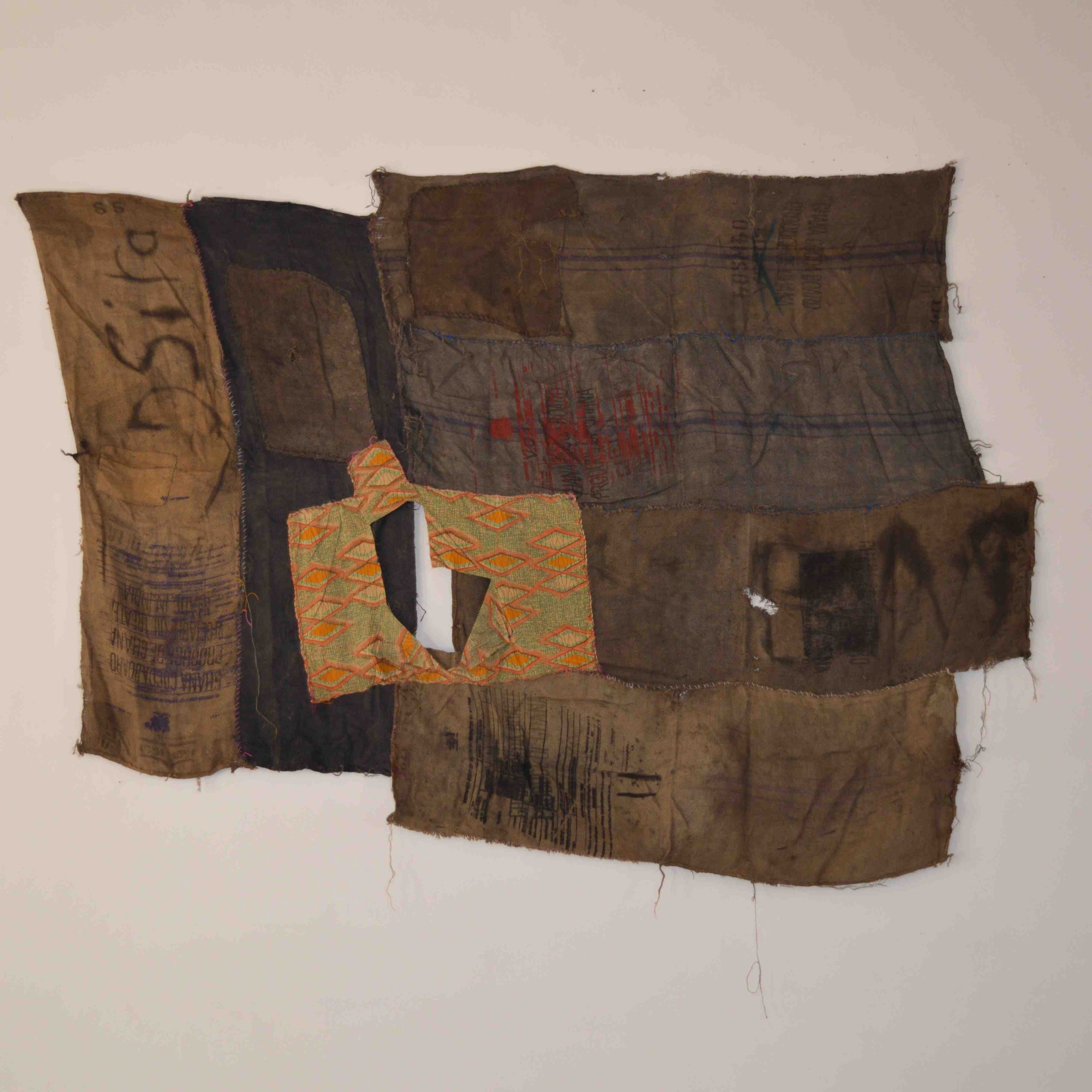 Ibrahim Mahama, Dsiya, 2015, Wax print and coal sacks on dyed sacks and coal sacks with screen prints and markings, 250  × 350  cm, Courtesy the artist and Modern Forms